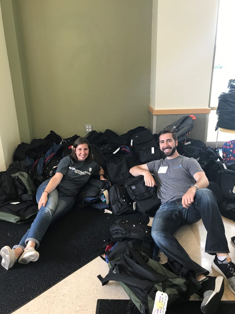 Volunteers Come Together to Fill 400+ Backpacks for Lawrence Hall Youth